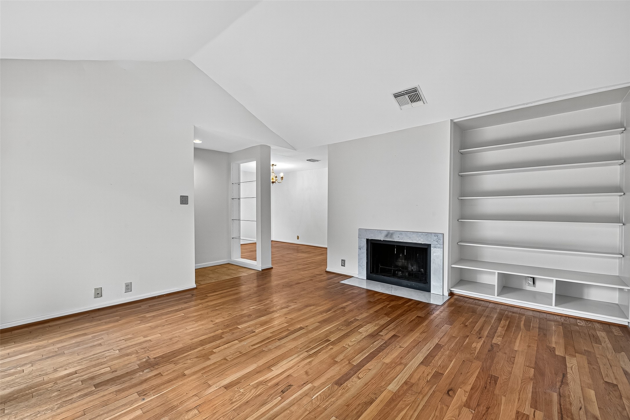 2829 Timmons Lane, Unit 176 Houston, TX 77027 - Photo 6 of 34 wooden floor fireplace and natural light in room