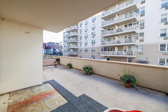 a view of front door with outdoor seating