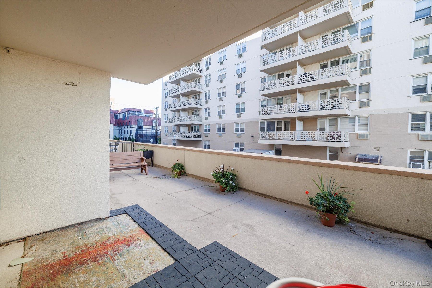 420 Shore Road, Unit 1F Long Beach, NY 11561 - Photo 4 of 32 a room with furniture and a rug