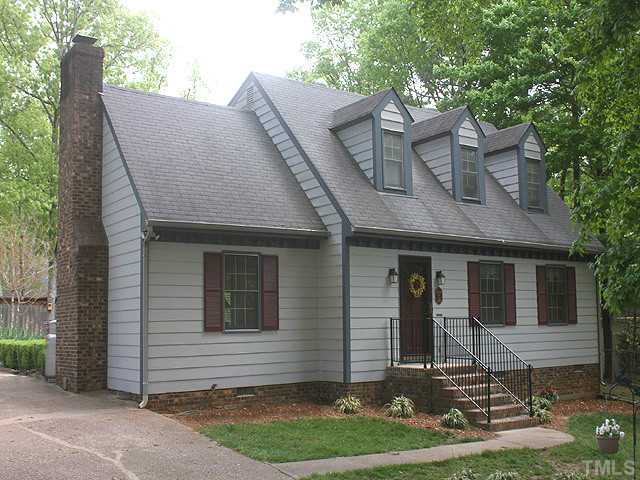 7320 Mill Ridge Road Raleigh, NC 27613 - Photo 3 of 25 a front view of a house with garden