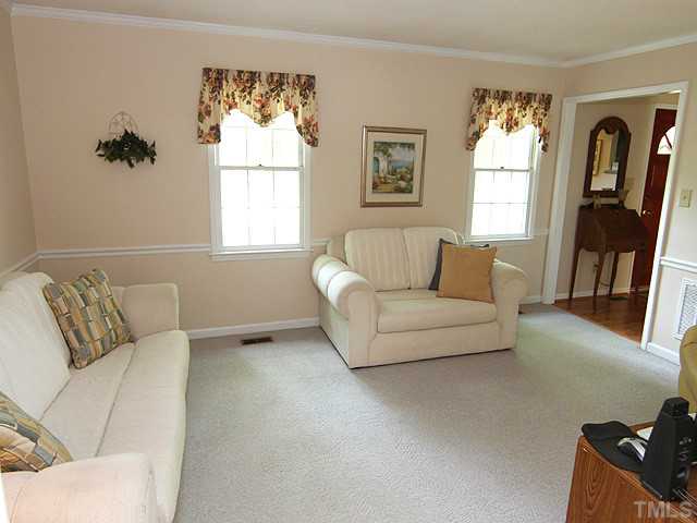 7320 Mill Ridge Road Raleigh, NC 27613 - Photo 6 of 25 a living room with furniture and a window