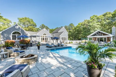 a front view of house with yard outdoor seating and barbeque oven