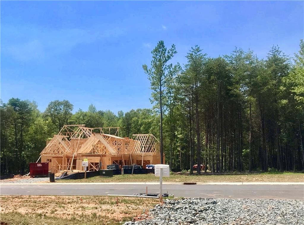2854 Holbrook Road, Unit 10 Fort Mill, SC 29715 - Photo 12 of 13 a view of a house with a yard and large trees