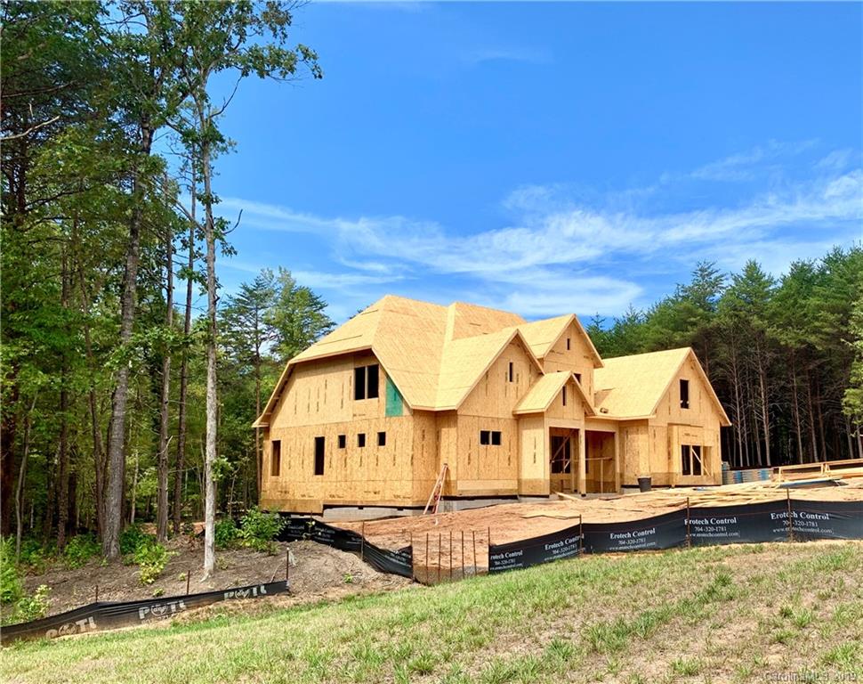 2854 Holbrook Road, Unit 10 Fort Mill, SC 29715 - Photo 13 of 13 a view of a house with a big yard and large trees