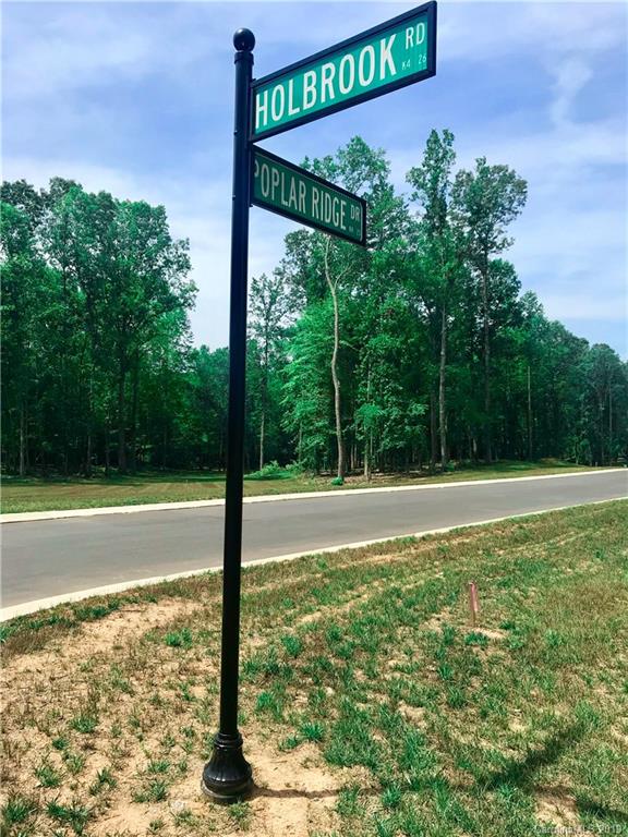 2854 Holbrook Road, Unit 10 Fort Mill, SC 29715 - Photo 5 of 13 a view of a field with a tree in the background