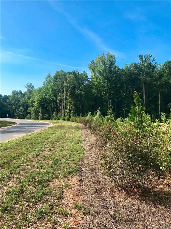 2854 Holbrook Road, Unit 10 Fort Mill, SC 29715 - Photo 7 of 13 a view of a green field with lots of bushes