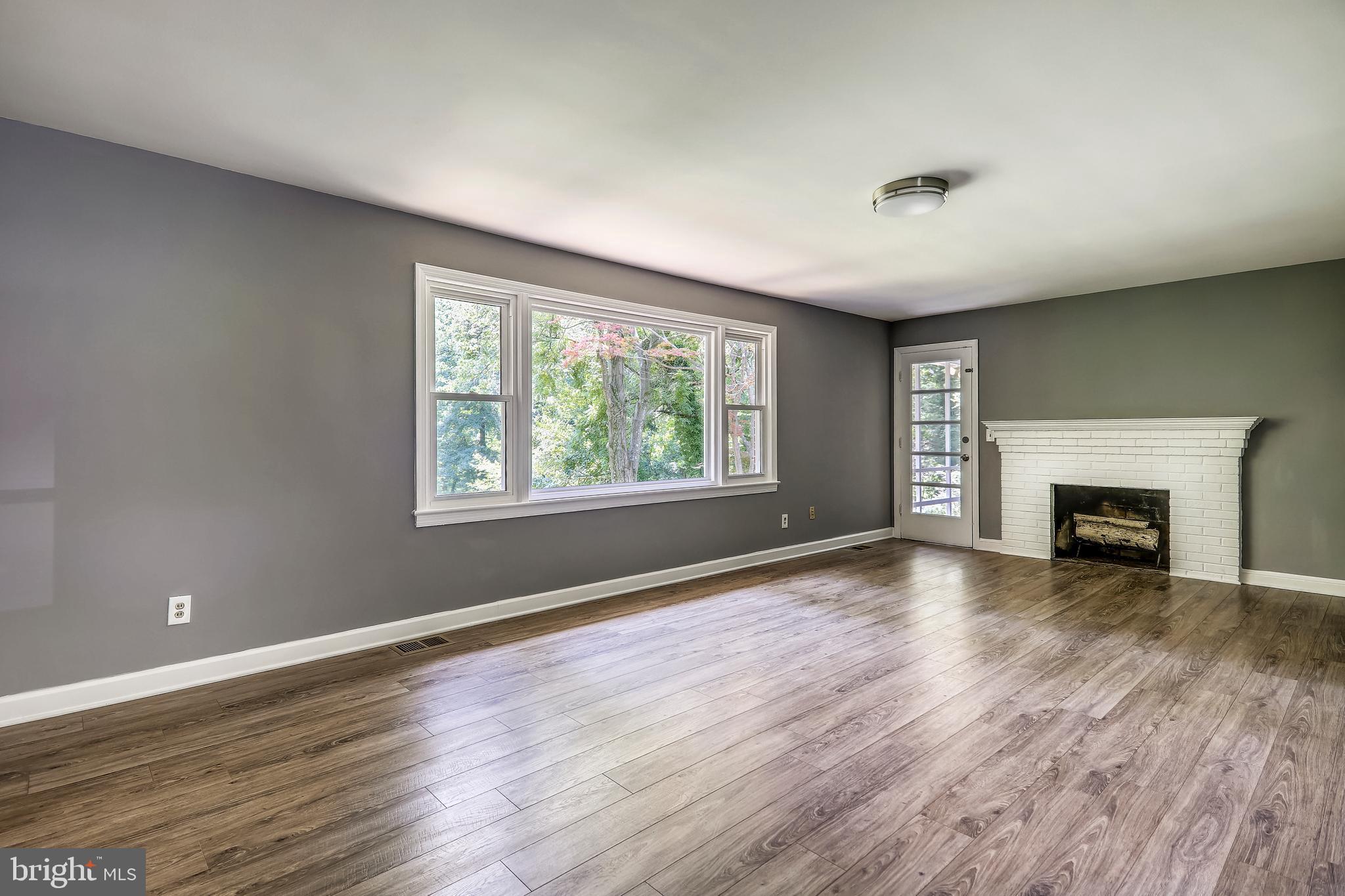 4501 Henderson Road Temple Hills, MD 20748 - Photo 10 of 45 main level family room with door to screen porch