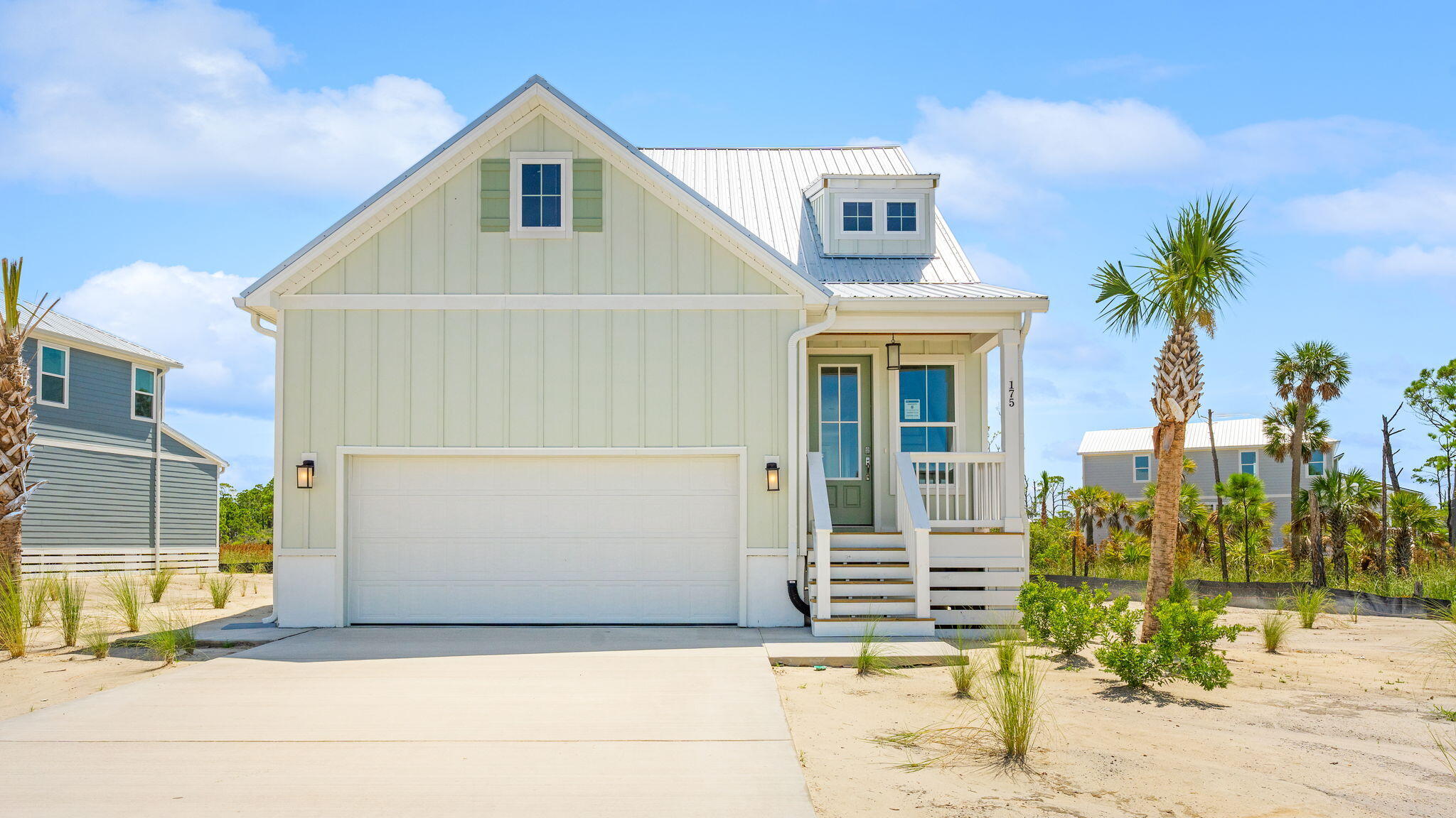 175 Marsh View Ridge Ln Cape Port St. Joe, FL 32456 - Photo 2 of 41 a front view of a house with a yard