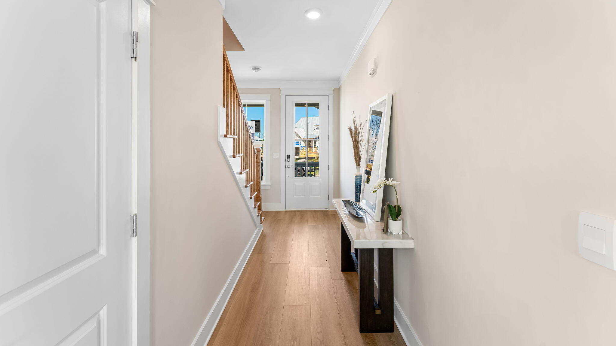 175 Marsh View Ridge Ln Cape Port St. Joe, FL 32456 - Photo 21 of 41 a view of a hallway with wooden floor and stairs
