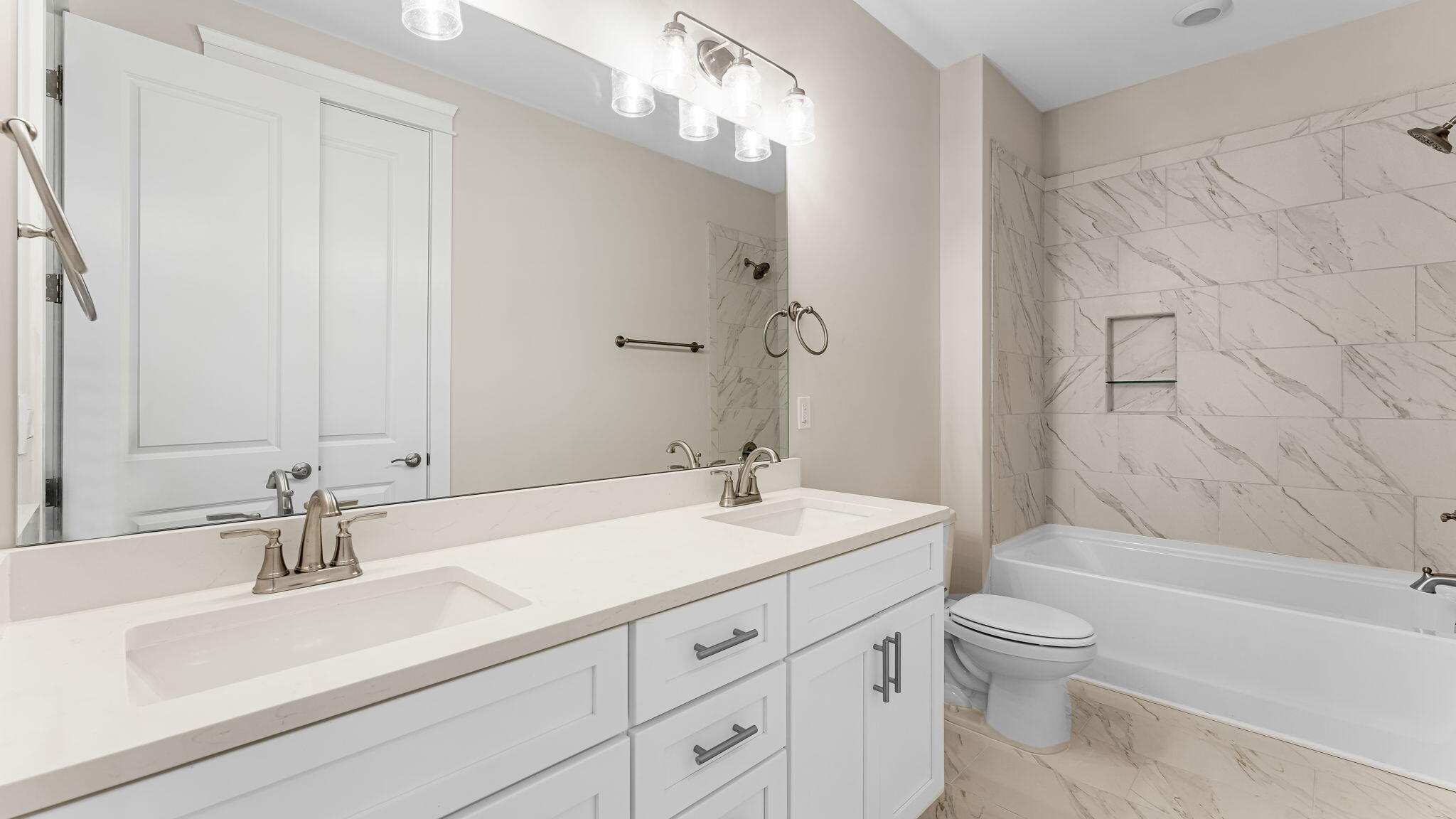 175 Marsh View Ridge Ln Cape Port St. Joe, FL 32456 - Photo 27 of 41 a bathroom with a sink a toilet and shower