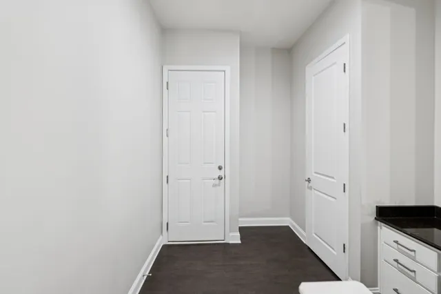 a living room with furniture a fireplace and a large window