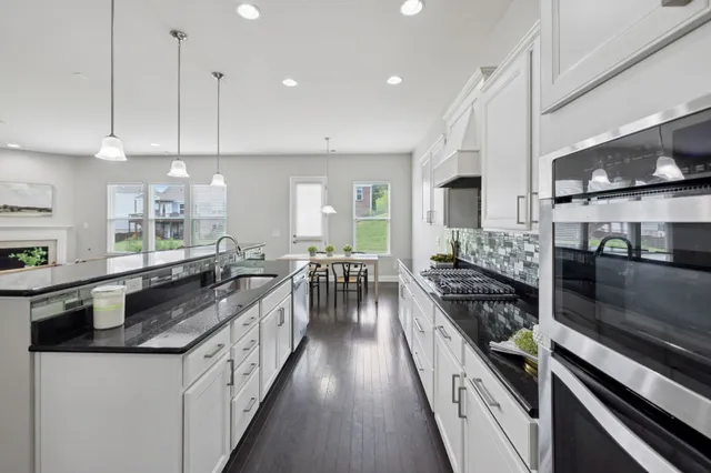 a kitchen with a sink and a refrigerator