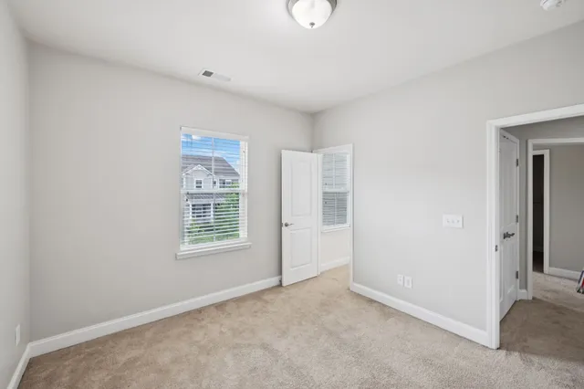 a bathroom with a granite countertop sink a mirror and a bathtub