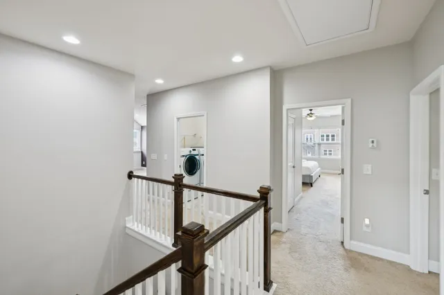 a bedroom with bed couches and flat screen tv