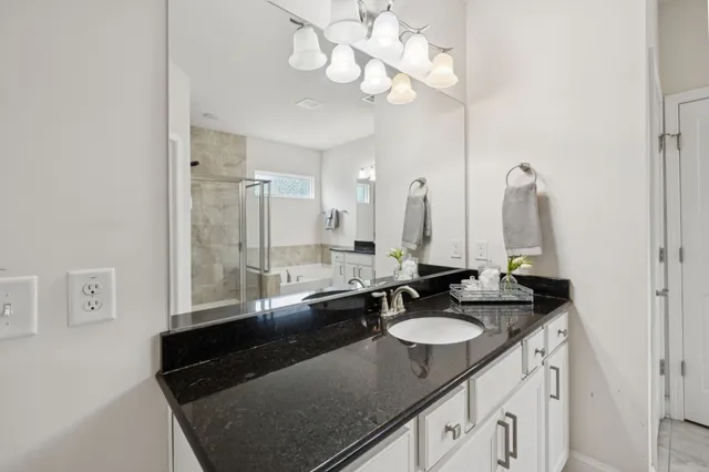 a bed room with a bed and a night stand