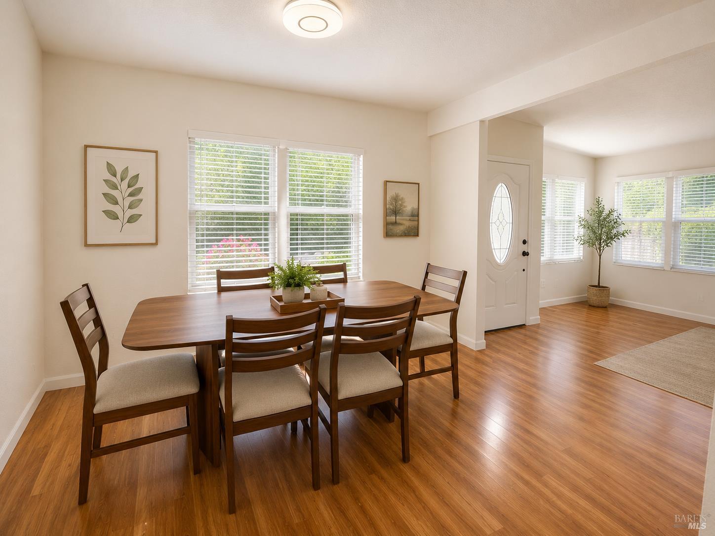 1945 Piner Road, Unit 16 Santa Rosa, CA 95403 - Photo 8 of 18 a dining room with furniture and wooden floor