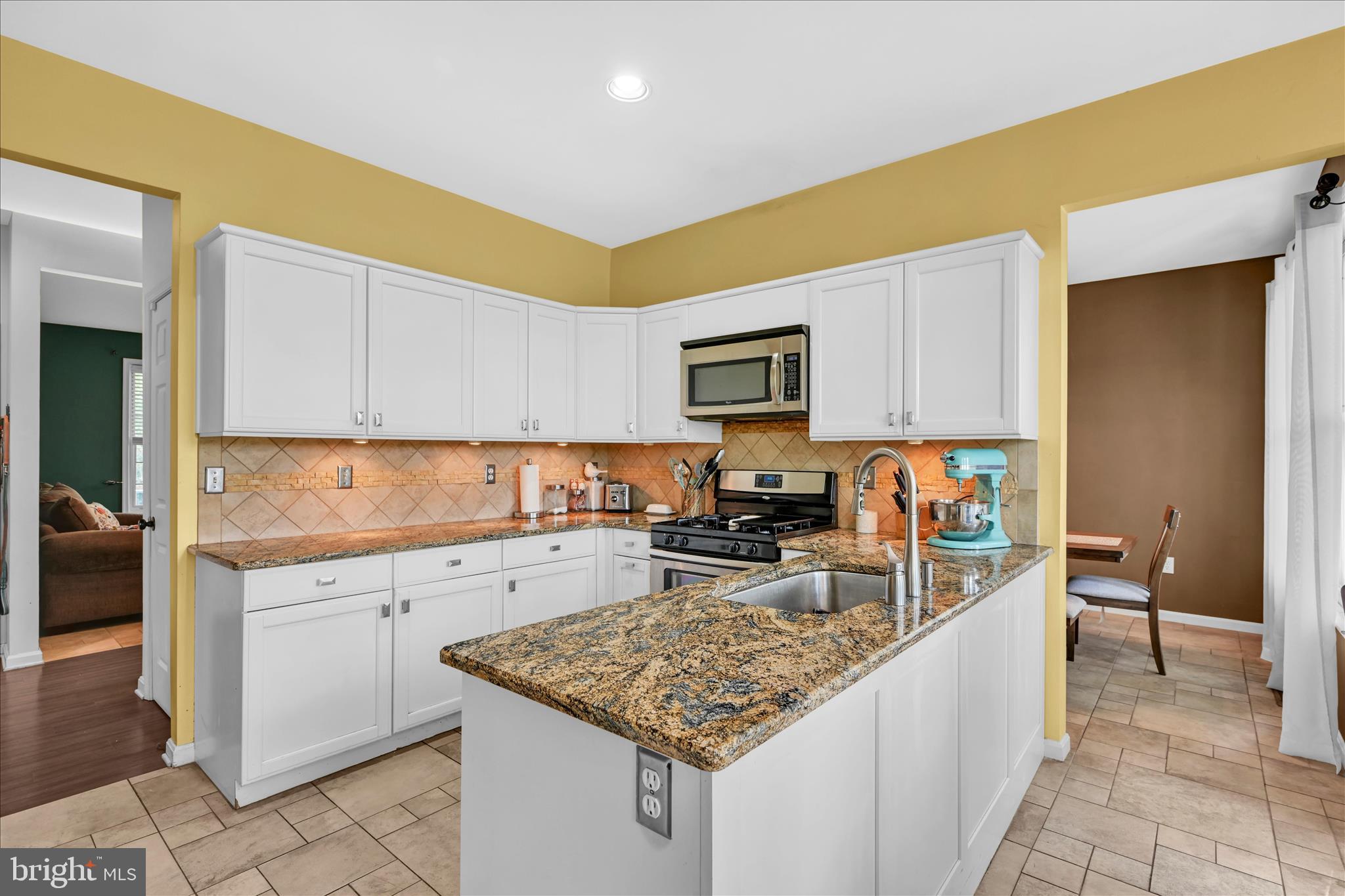 1602 Churchill Road Harrisburg, PA 17111 - Photo 23 of 61 a kitchen with a sink stove and cabinets
