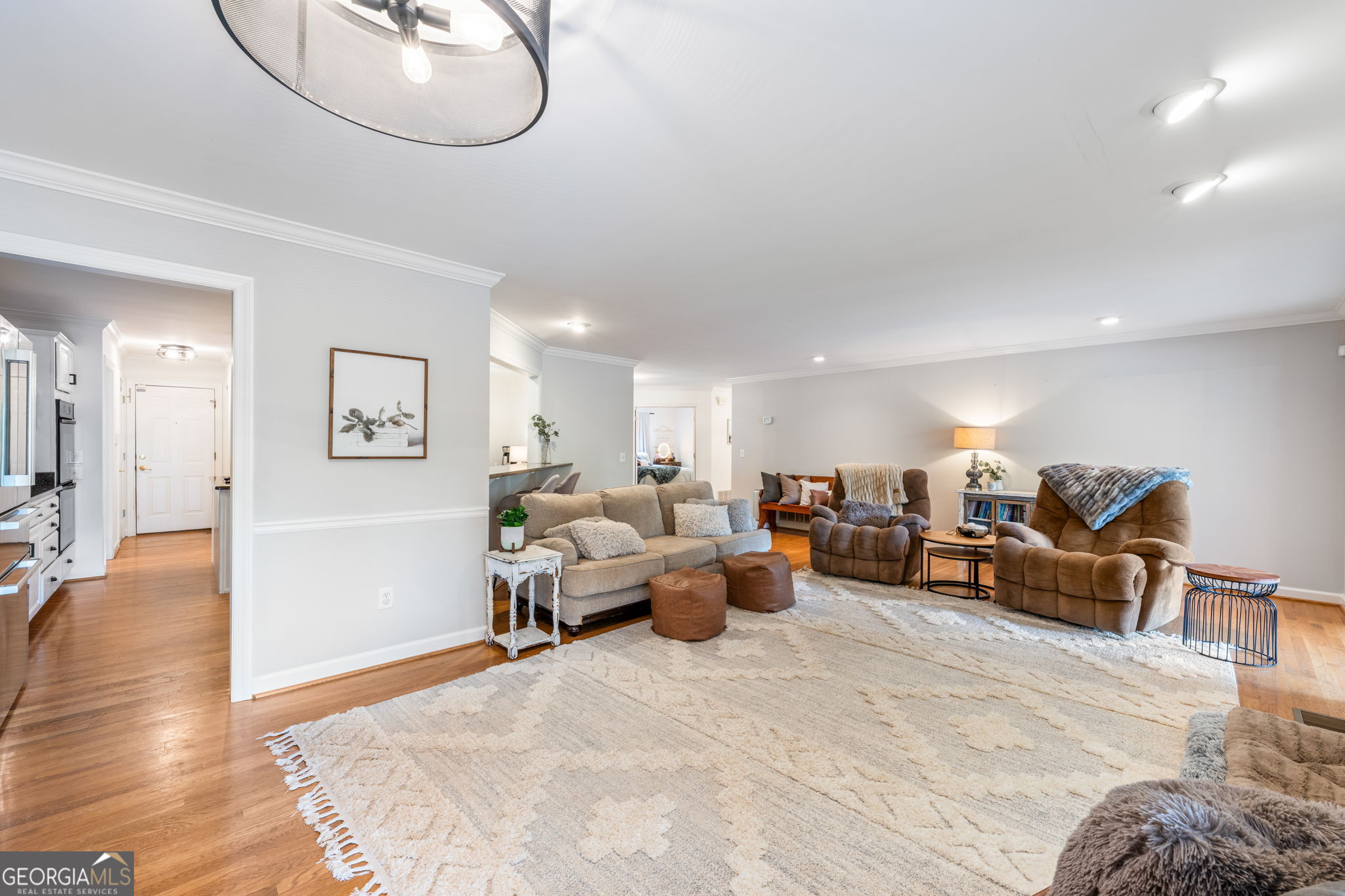 570 Martin Mill Road Moreland, GA 30259 - Photo 12 of 68 a living room with furniture chandelier and a wooden floor