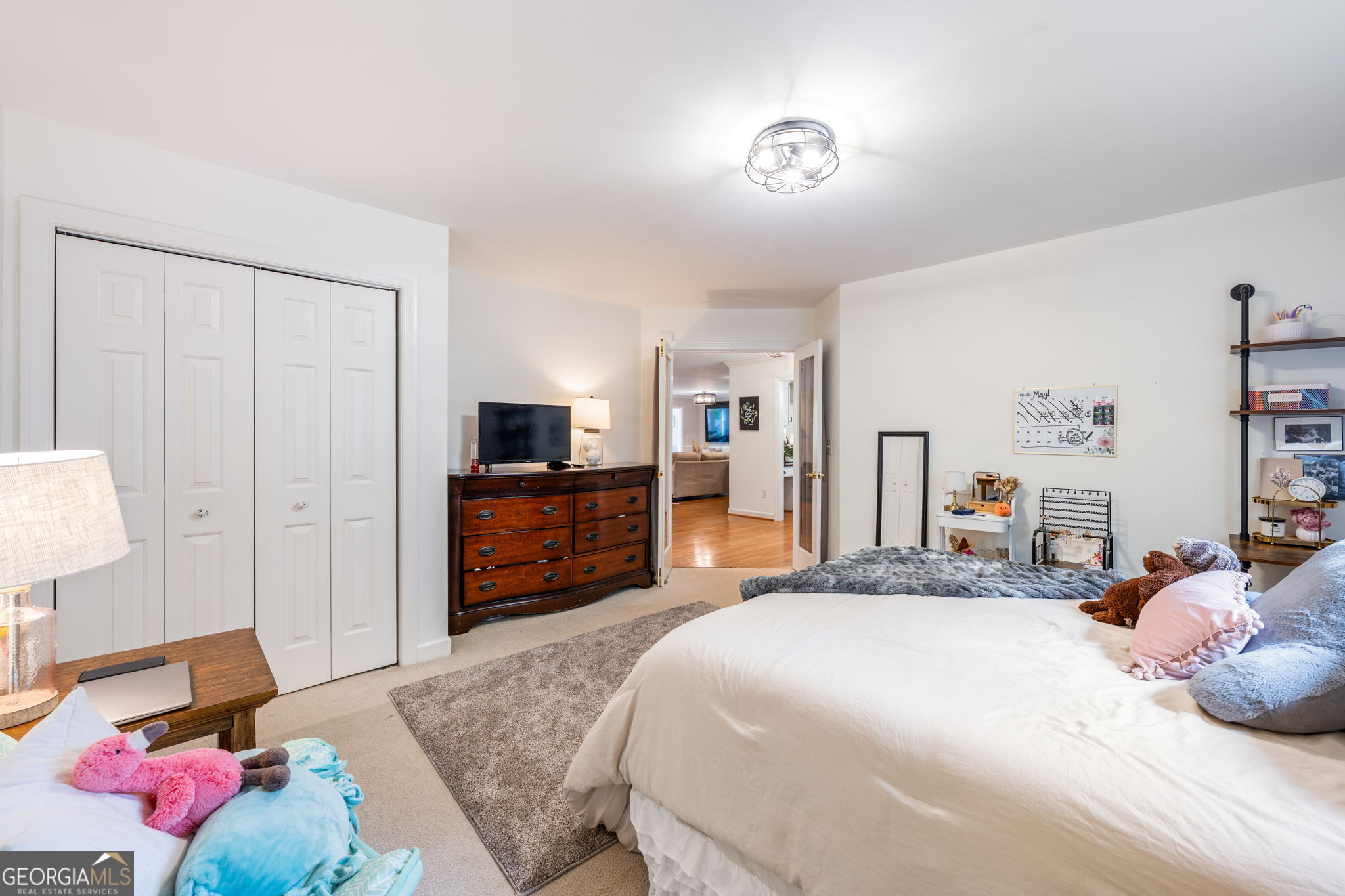570 Martin Mill Road Moreland, GA 30259 - Photo 33 of 68 a bedroom with a bed and wooden floor