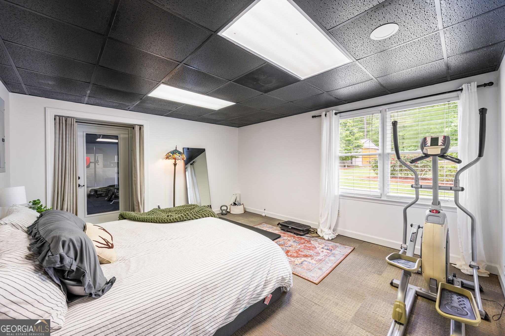 570 Martin Mill Road Moreland, GA 30259 - Photo 43 of 68 a bedroom with a bed and wooden floor