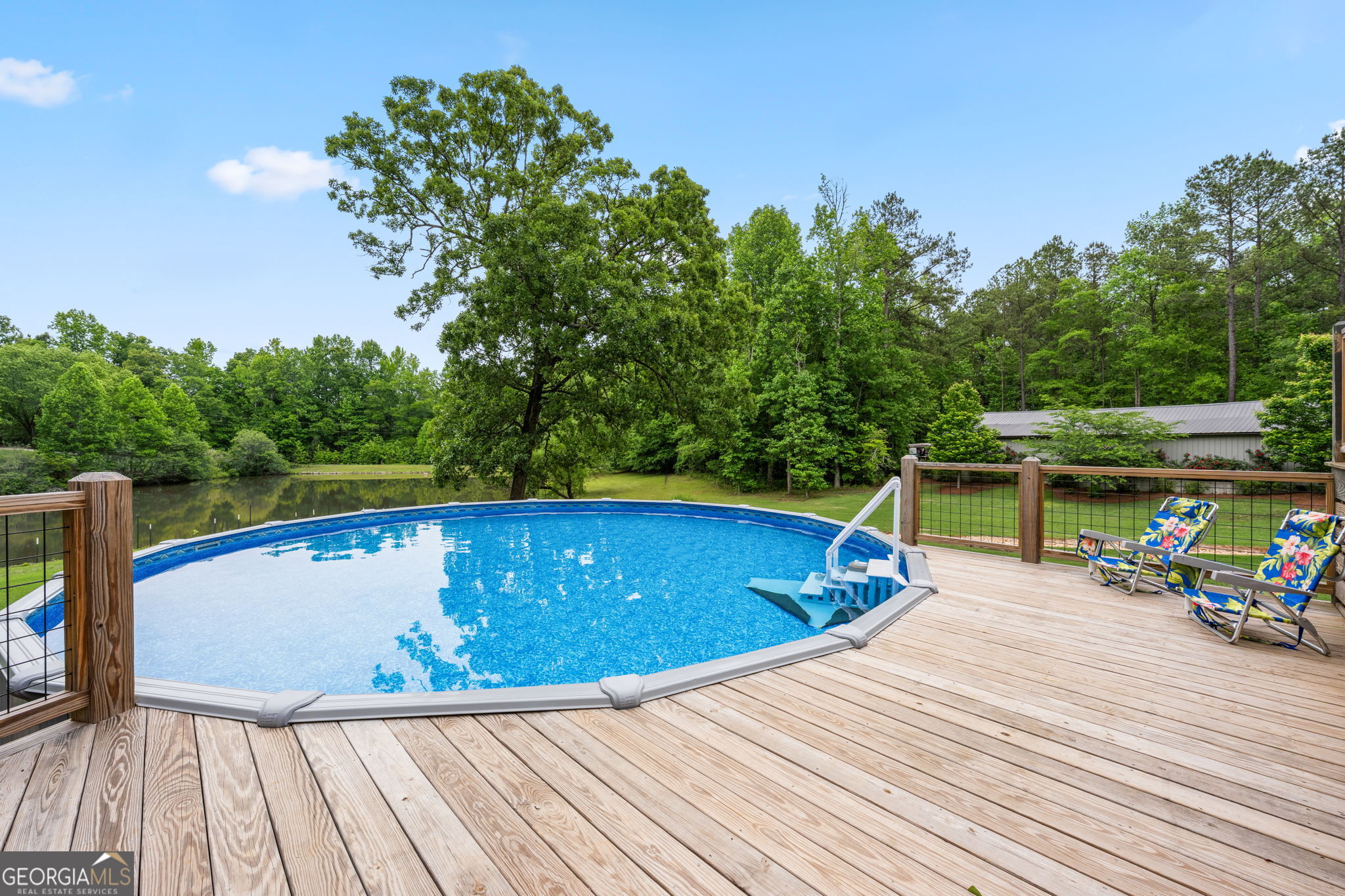 570 Martin Mill Road Moreland, GA 30259 - Photo 52 of 68 a view of a swimming pool with a patio