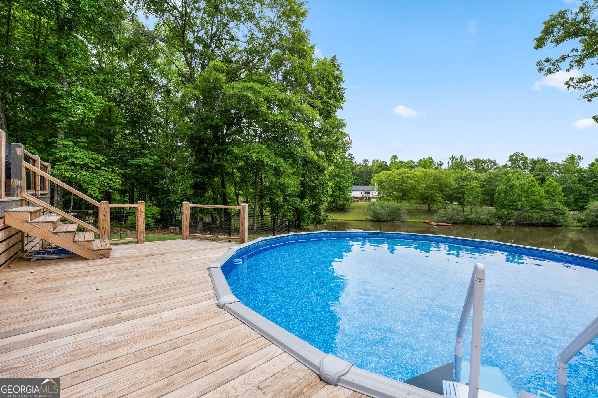 570 Martin Mill Road Moreland, GA 30259 - Photo 53 of 68 a view of a swimming pool with an outdoor space and seating area