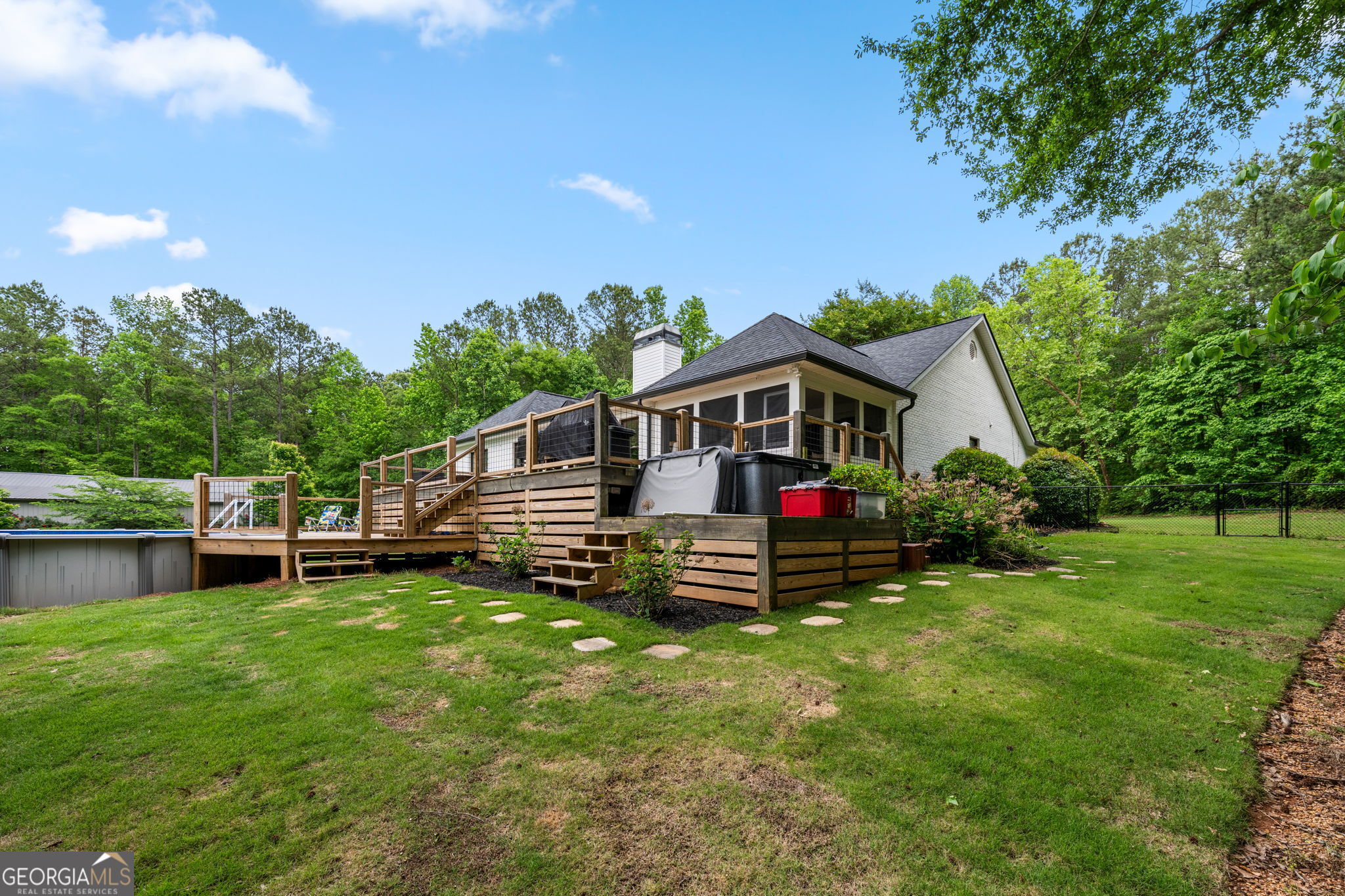 570 Martin Mill Road Moreland, GA 30259 - Photo 54 of 68 a front view of a house with a yard table and chairs
