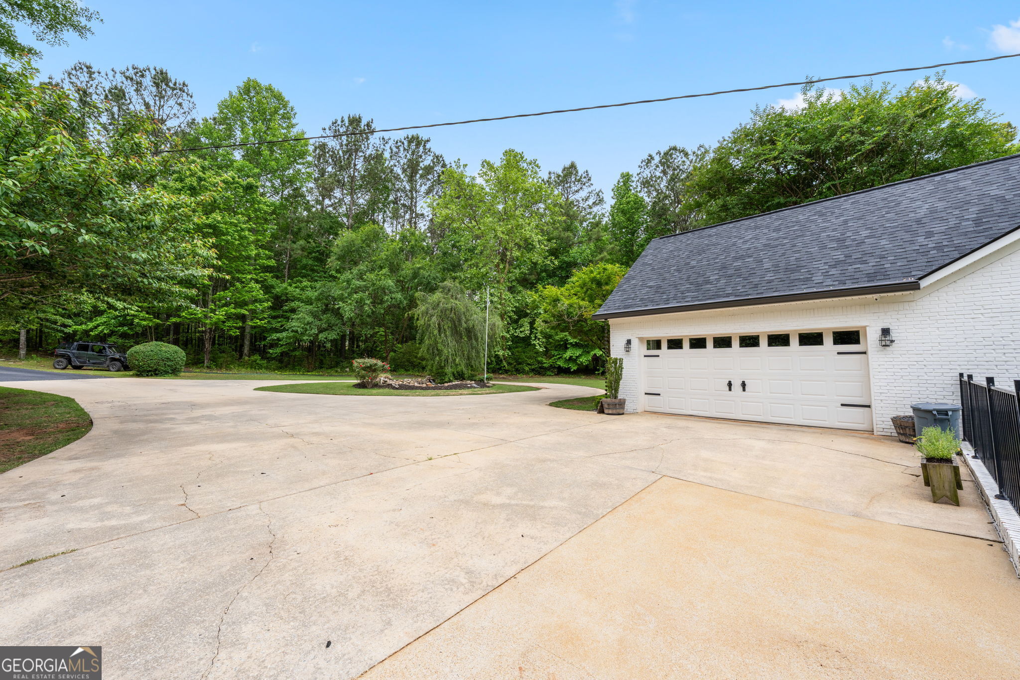 570 Martin Mill Road Moreland, GA 30259 - Photo 56 of 68 a view of a house with a yard and a large tree