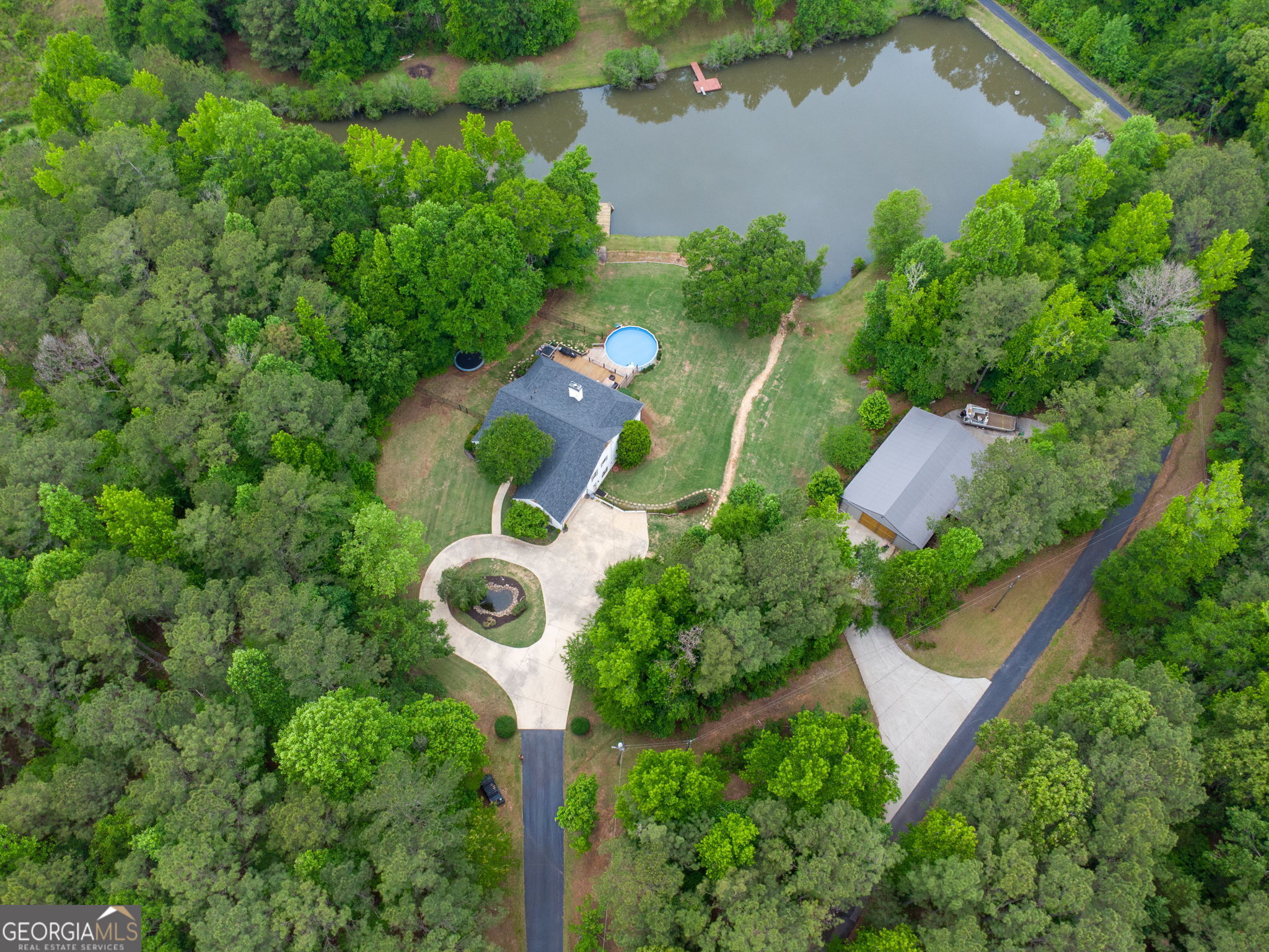 570 Martin Mill Road Moreland, GA 30259 - Photo 67 of 68 an aerial view of a house with a yard and lake view