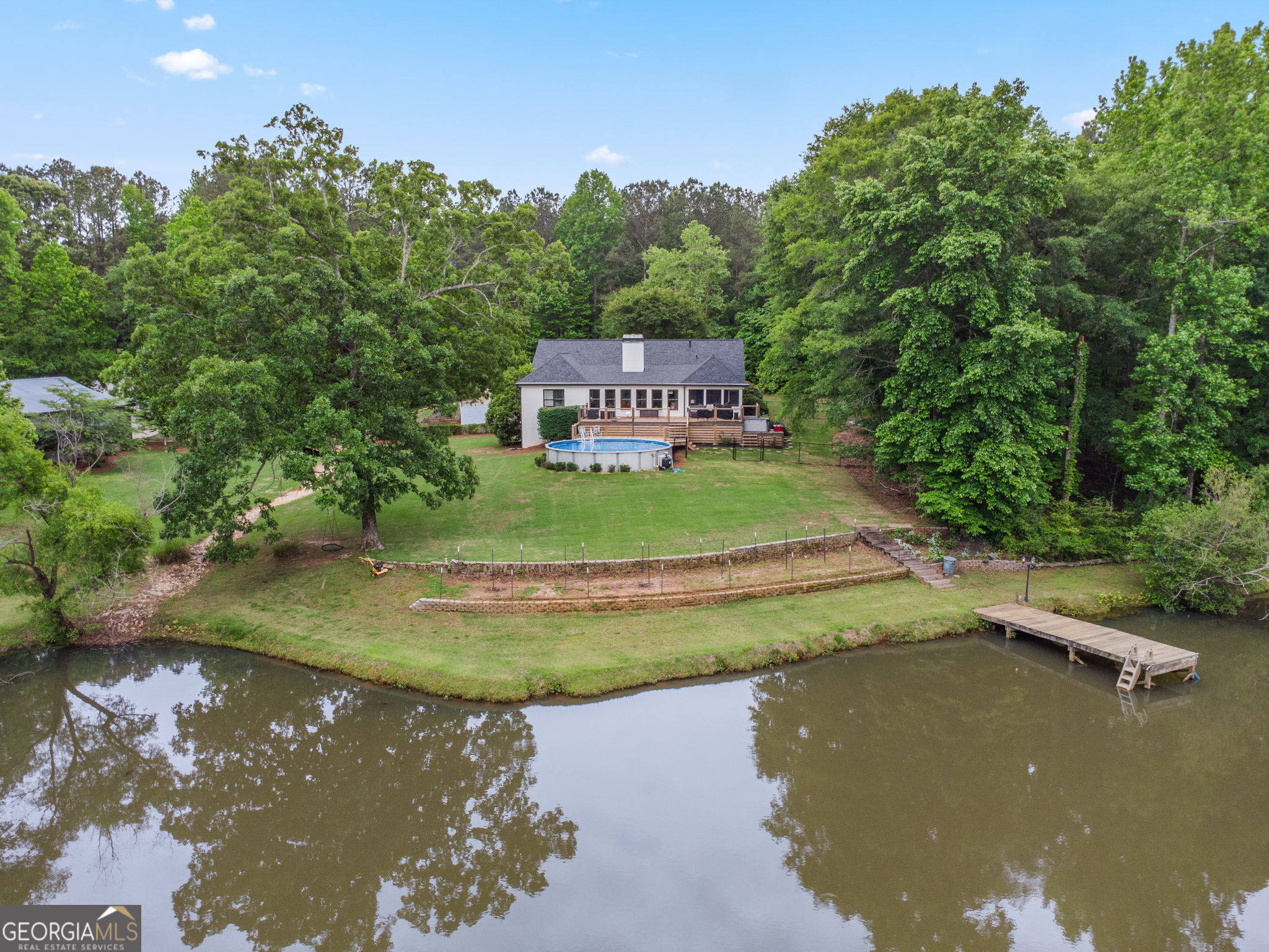 570 Martin Mill Road Moreland, GA 30259 - Photo 68 of 68 a view of a lake with a yard
