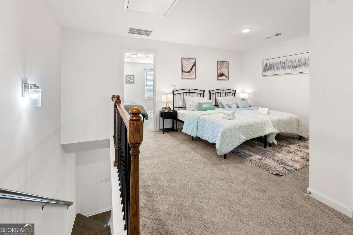 849 Crestwell Circle Atlanta, GA 30331 - Photo 12 of 21 a bed room with furniture and a window