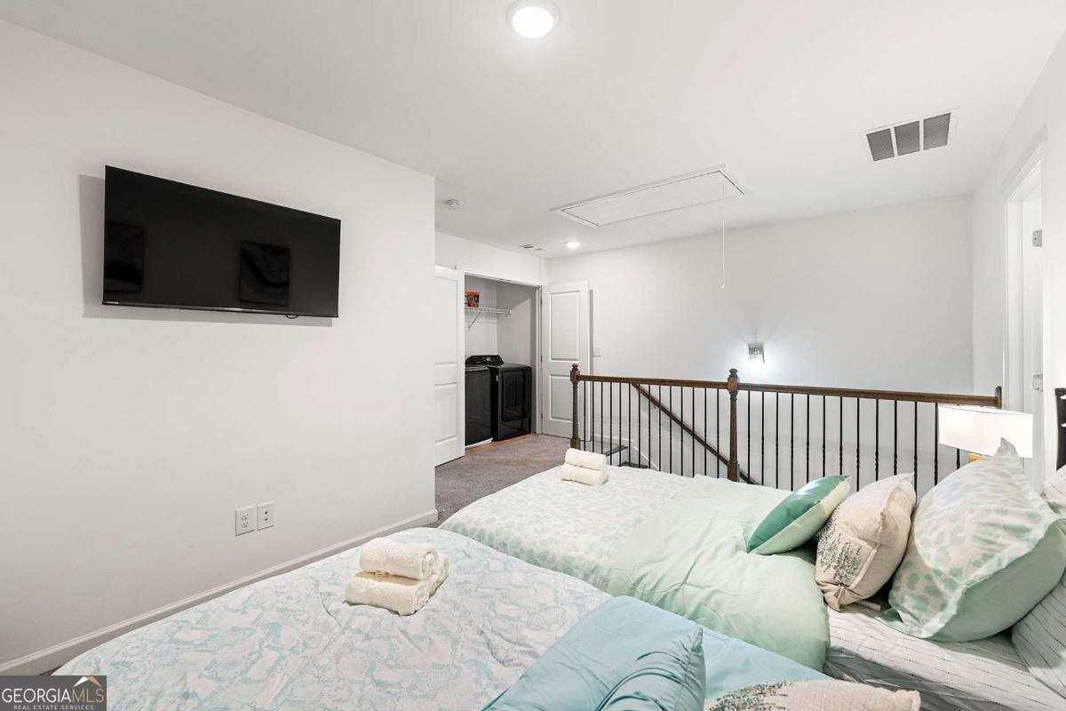 849 Crestwell Circle Atlanta, GA 30331 - Photo 14 of 21 a view of a bedroom with furniture and tv