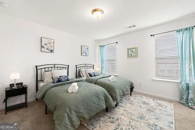 a bedroom with bed and a window