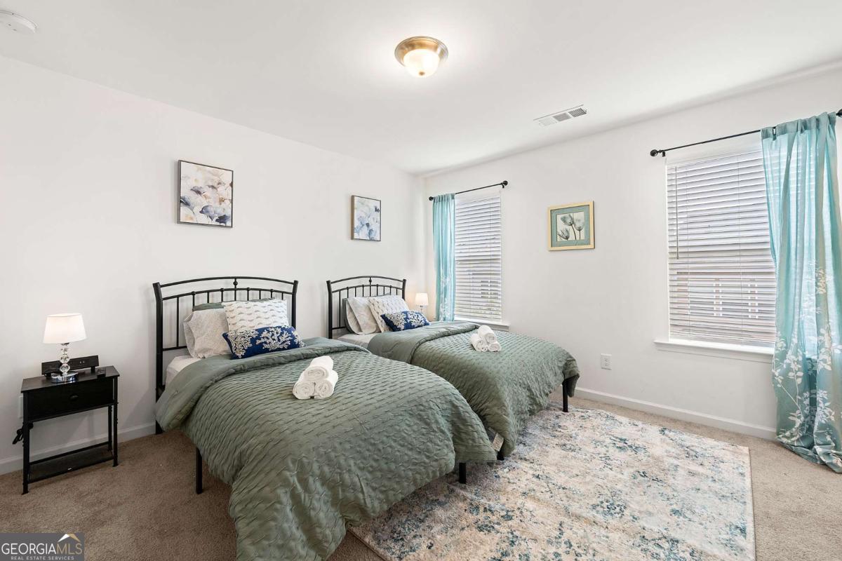 849 Crestwell Circle Atlanta, GA 30331 - Photo 15 of 21 a bedroom with bed and a window