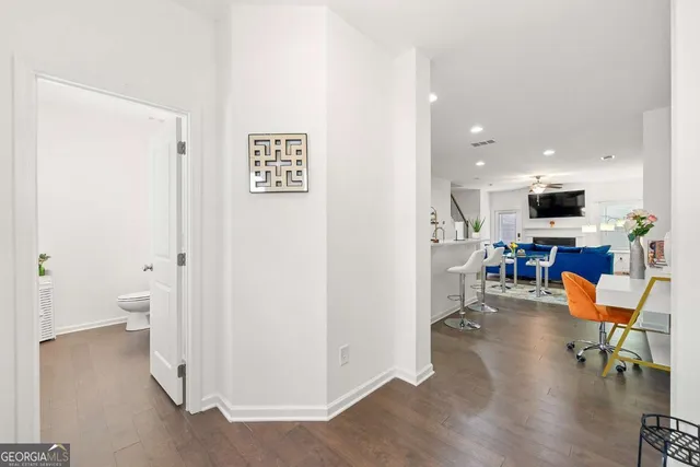 a view of entryway with kitchen view and living room view