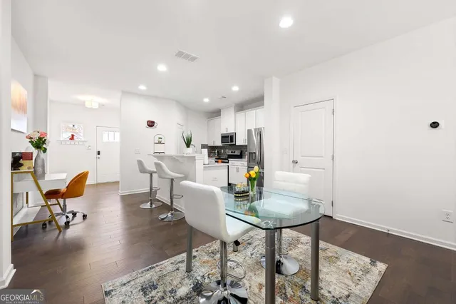 a view of a dining room with furniture
