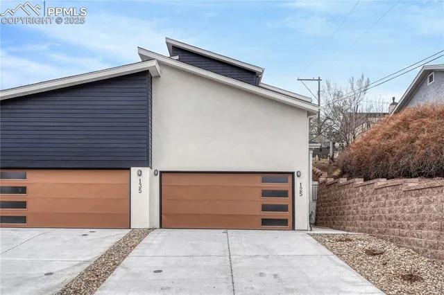 a front view of a house with garage