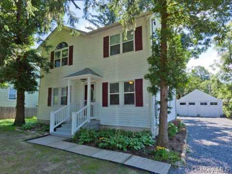 71 Walnut Road Kings Park, NY 11754 - Photo 1 of 1 a front view of a house with garden