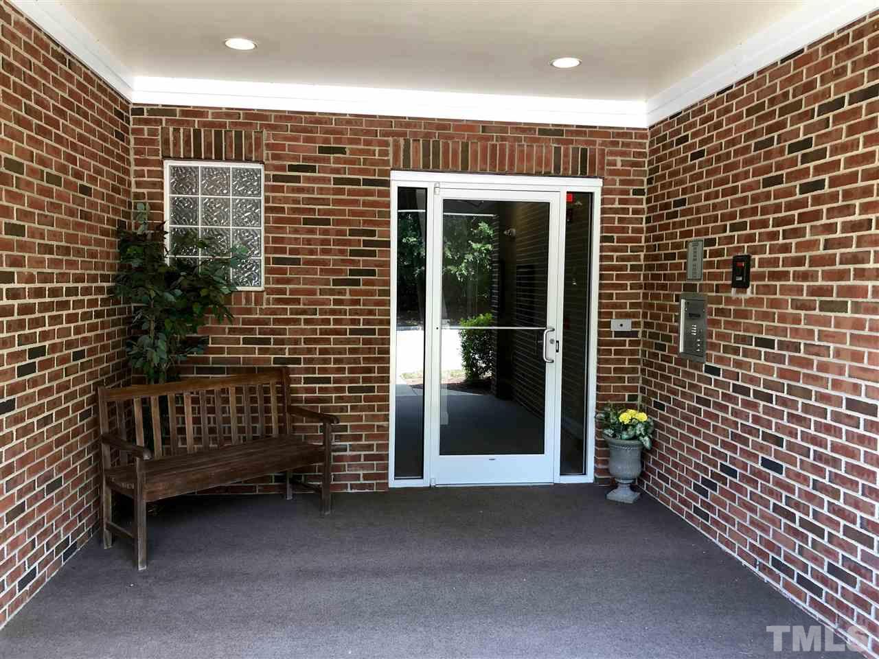 212 West Savannah Ridge Road, Unit 212 Holly Springs, NC 27540 - Photo 2 of 21 a view of entryway with door