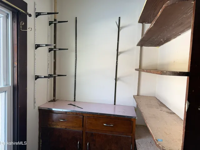 a bathroom with a shower and a sink