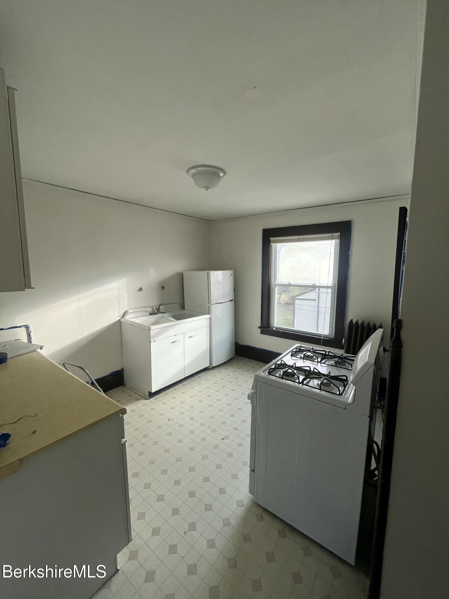 115 Bridge Street Great Barrington, MA 01230 - Photo 5 of 21 a living room with furniture and a flat screen tv