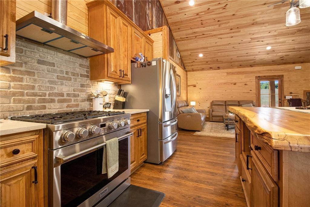 111 Possum Trot Road Barnesville, GA 30204 - Photo 11 of 54 a kitchen with a stove and a refrigerator