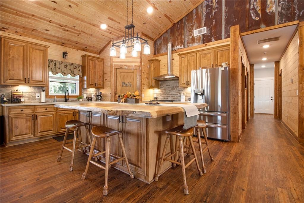111 Possum Trot Road Barnesville, GA 30204 - Photo 12 of 54 a view of a dining room with furniture and wooden floor
