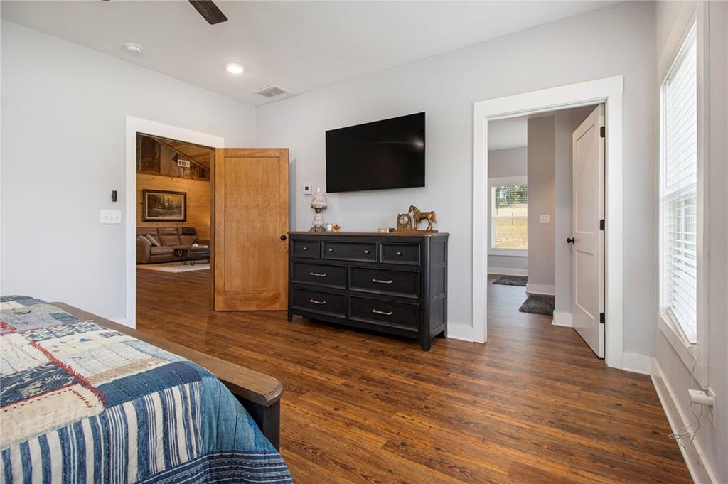 111 Possum Trot Road Barnesville, GA 30204 - Photo 17 of 54 a living room with furniture and a flat screen tv