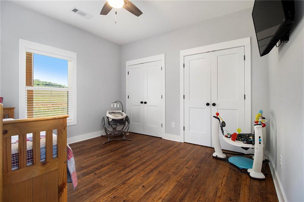 111 Possum Trot Road Barnesville, GA 30204 - Photo 27 of 54 a living room with furniture and a wooden floor