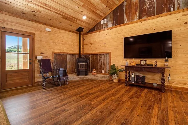 a living room filled with furniture and a flat screen tv