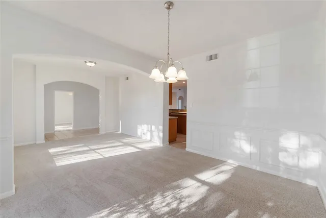 a view of a room with a chandelier