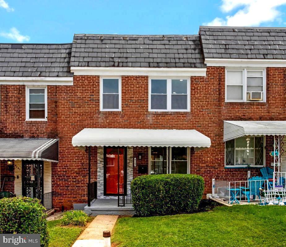 4243 Flowerton Road Baltimore, MD 21229 - Photo 1 of 35 a front view of a house with a yard
