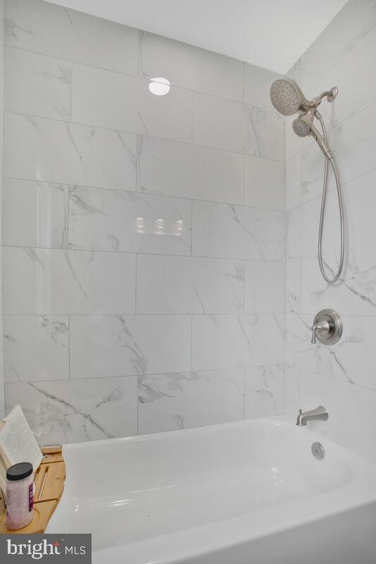 4243 Flowerton Road Baltimore, MD 21229 - Photo 22 of 35 a bathroom with a bathtub
