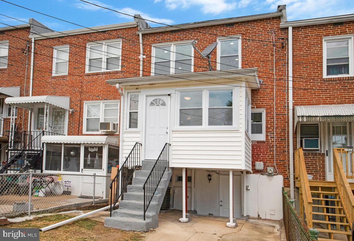 4243 Flowerton Road Baltimore, MD 21229 - Photo 32 of 35 a front view of a house with outdoor seating